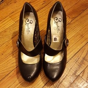 Black high heel shoes with button